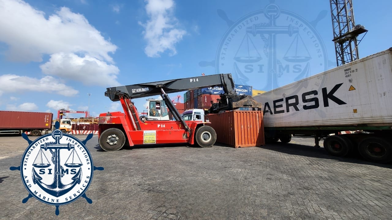Reach stacker handling a container during inspection
