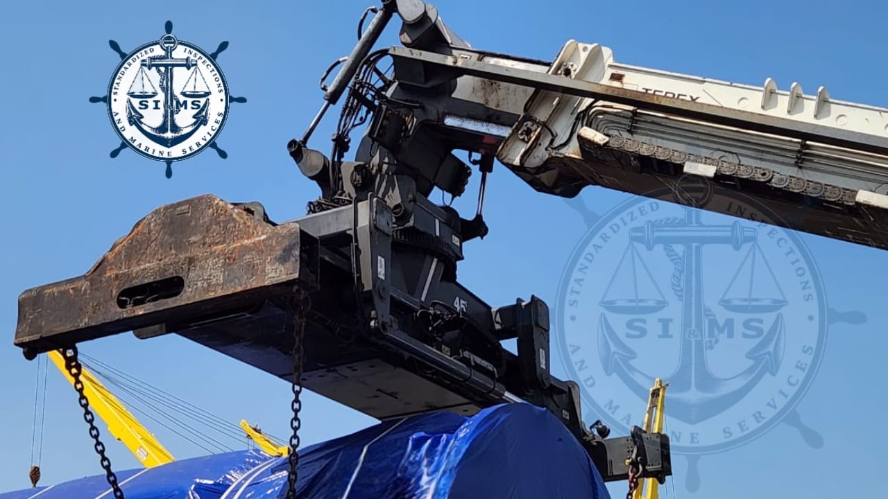Spreader attachment engaged on a wrapped unit