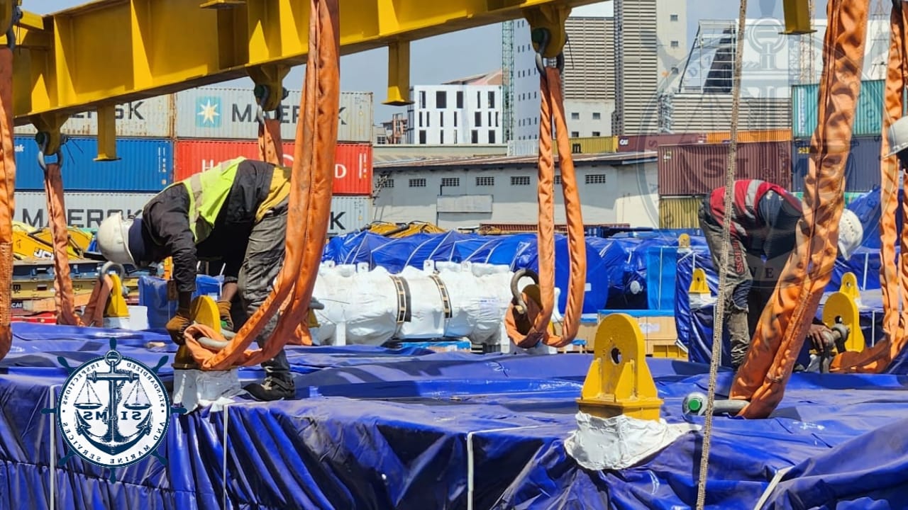Riggers setting slings and shackles on the lifting points